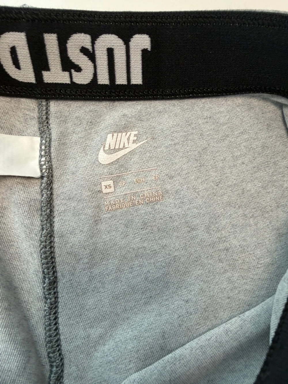 Nike Gray Athletic Leggings with Bold Black Graphic